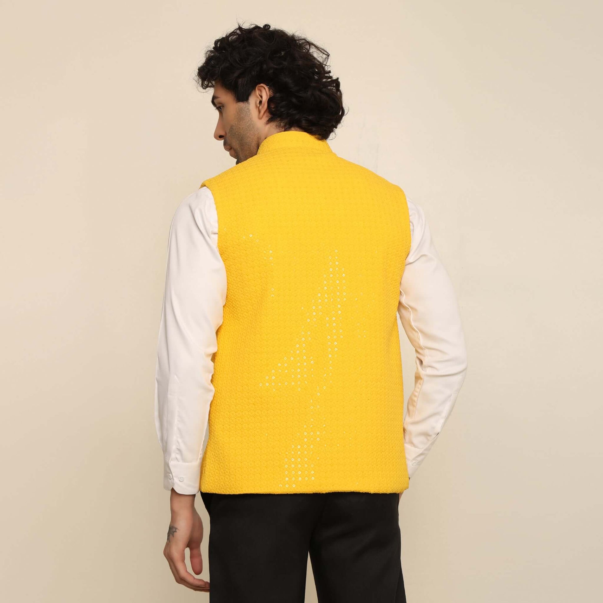 Yellow Sequins Embellished Chikankari Nehru Jacket which has chikankari and sequins work. Perfect mens yellow wedding nehru jacket for male by Crease India.