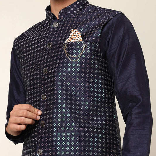 Evening Blue kurta with nehru jacket for men which is made up of dupion silk and has sequence embroidery on it. Shop this evening blue designer wedding kurta jacket set for male from Crease India website.