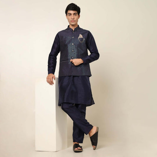 Evening Blue kurta with nehru jacket for men which is made up of dupion silk and has sequence embroidery on it. Shop this evening blue designer wedding kurta jacket set for male from Crease India website.