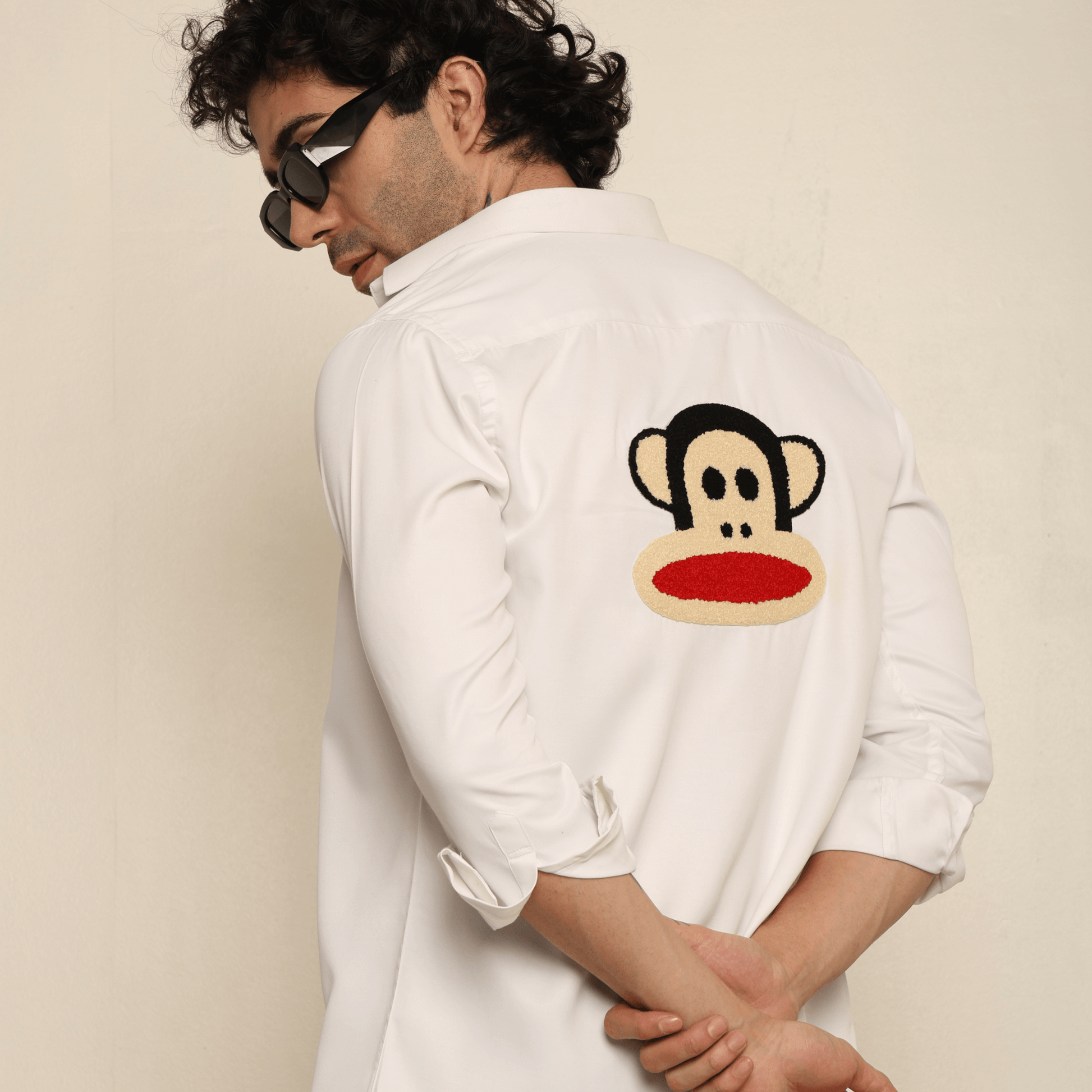 Mischief Alpha Monkey White Giza Satin Shirt for Men which is made up of giza satin and has monkey face design at back.  Perfect designer white custom shirt for all your casual wear.