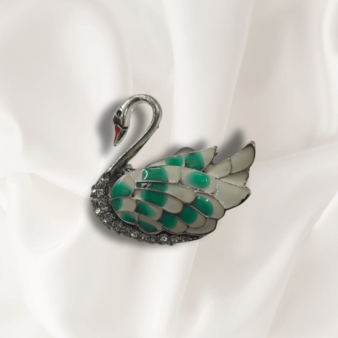 Men's Swan Brooch Lapel Pin for Tuxedos Suits Blazers and Kurtas on a white fabric.