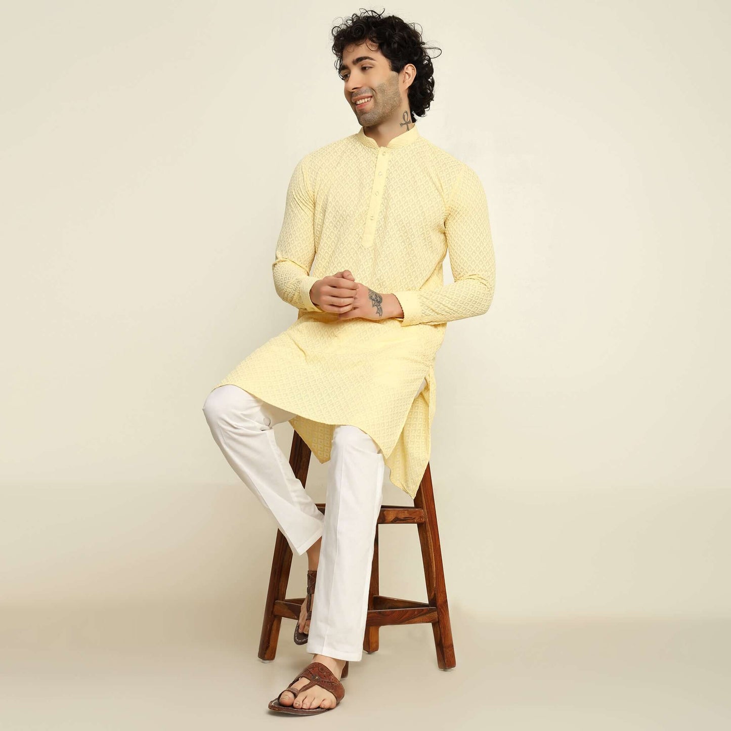 NAQSH Light Yellow Chikankari Kurta for Men which has chikankari embroidery. Perfect mens light yellow wedding kurta for male by Crease India.