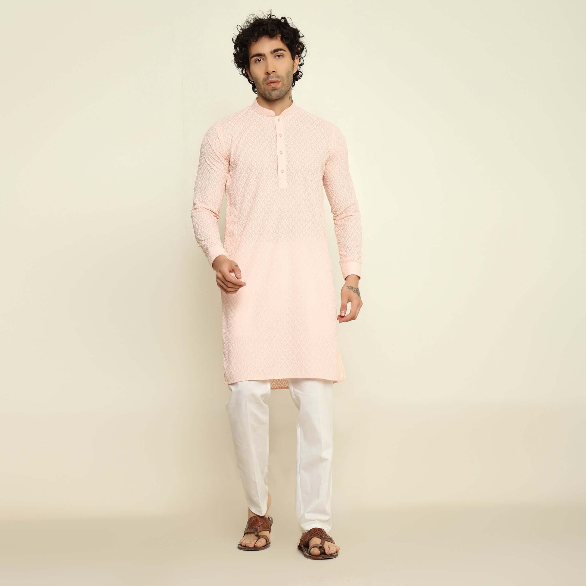 NAQSH Pastel Pink Chikankari Kurta for Men which has chikankari embroidery. Perfect mens pink wedding kurta for male by Crease India.