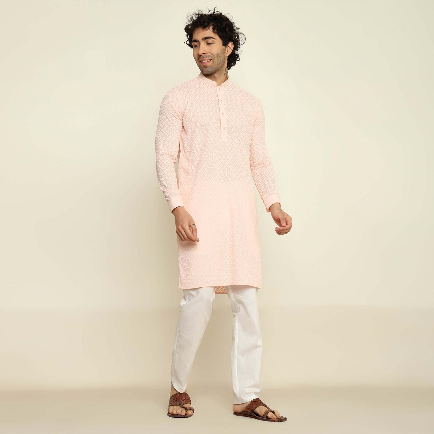 NAQSH Pastel Pink Chikankari Kurta for Men which has chikankari embroidery. Perfect mens pink wedding kurta for male by Crease India.