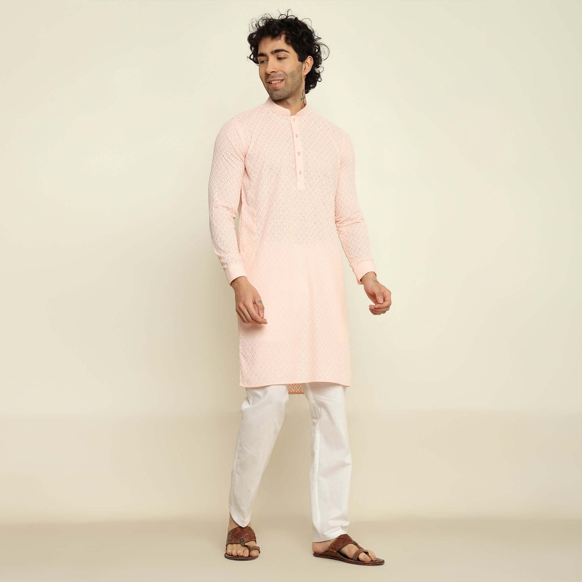 NAQSH Pastel Pink Chikankari Kurta for Men which has chikankari embroidery. Perfect mens pink wedding kurta for male by Crease India.