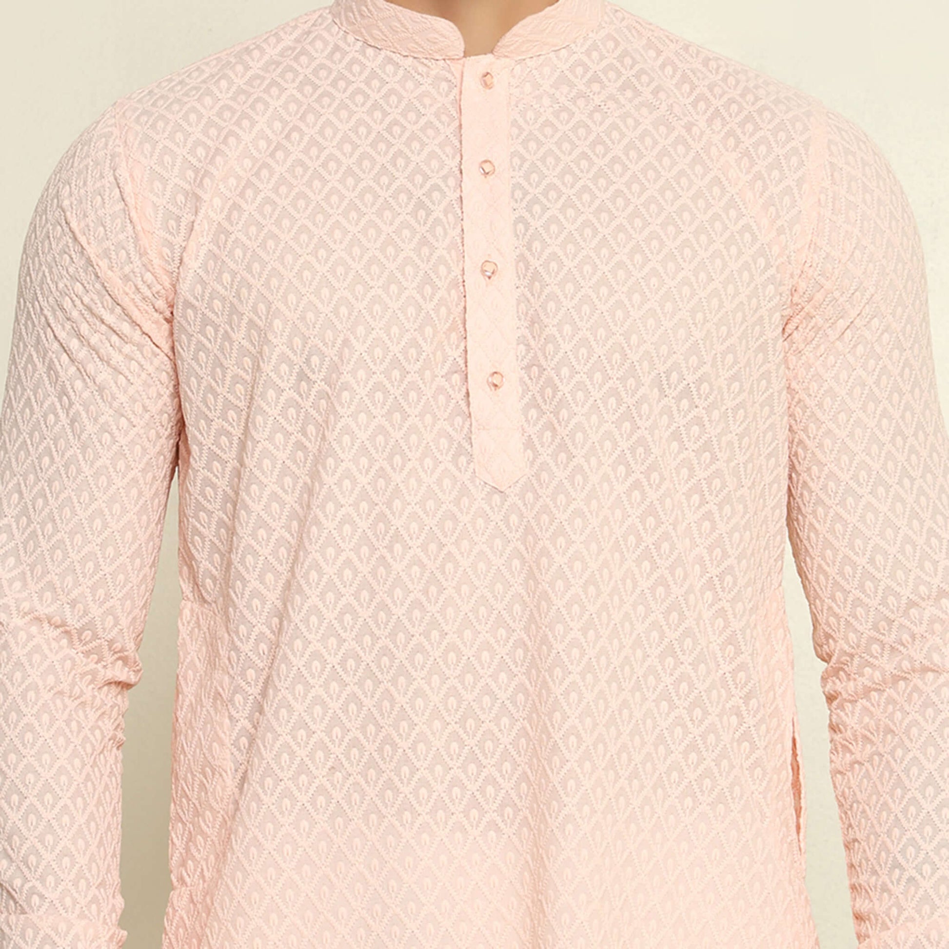 NAQSH Pastel Pink Chikankari Kurta for Men which has chikankari embroidery. Perfect mens pink wedding kurta for male by Crease India.