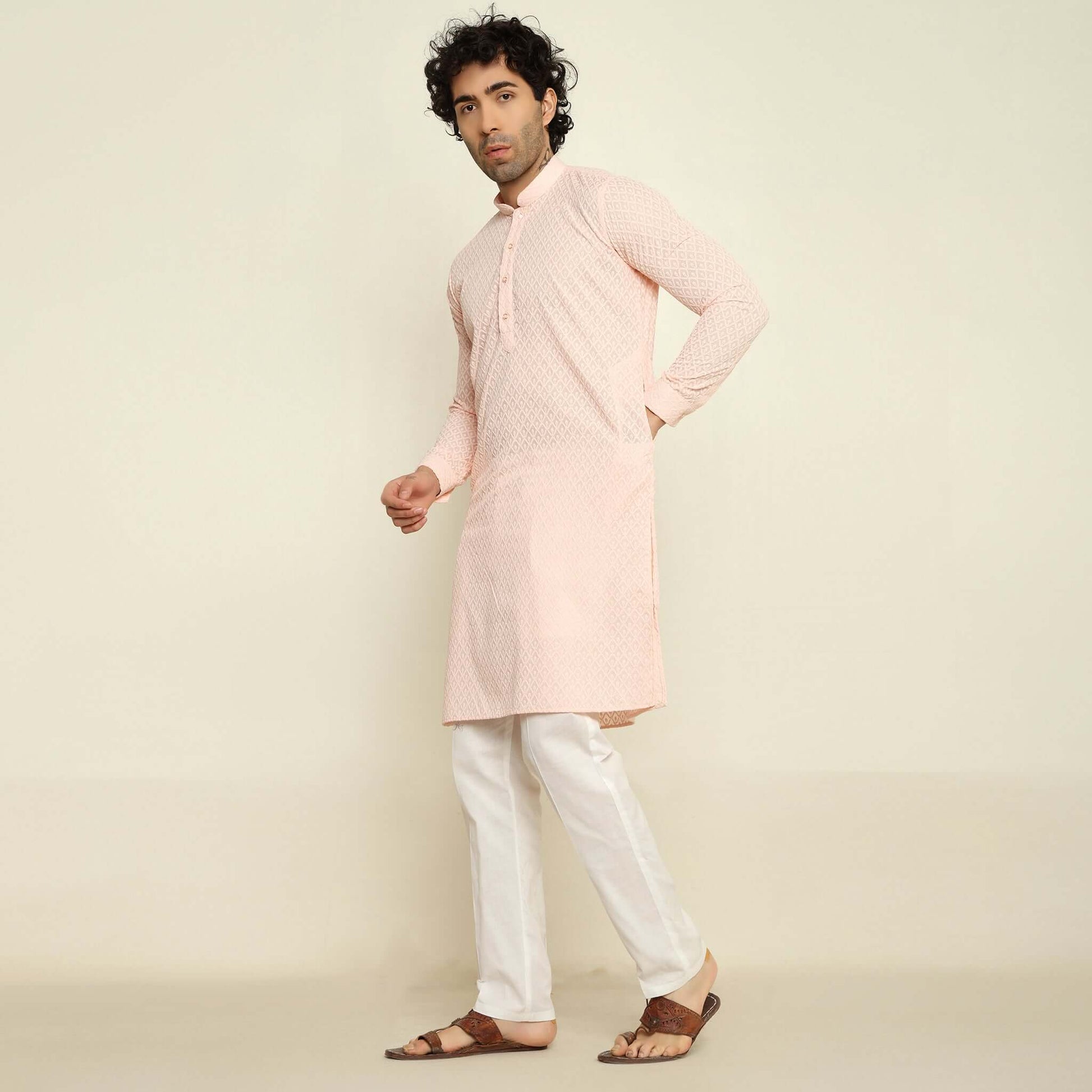 NAQSH Pastel Pink Chikankari Kurta for Men which has chikankari embroidery. Perfect mens pink wedding kurta for male by Crease India.
