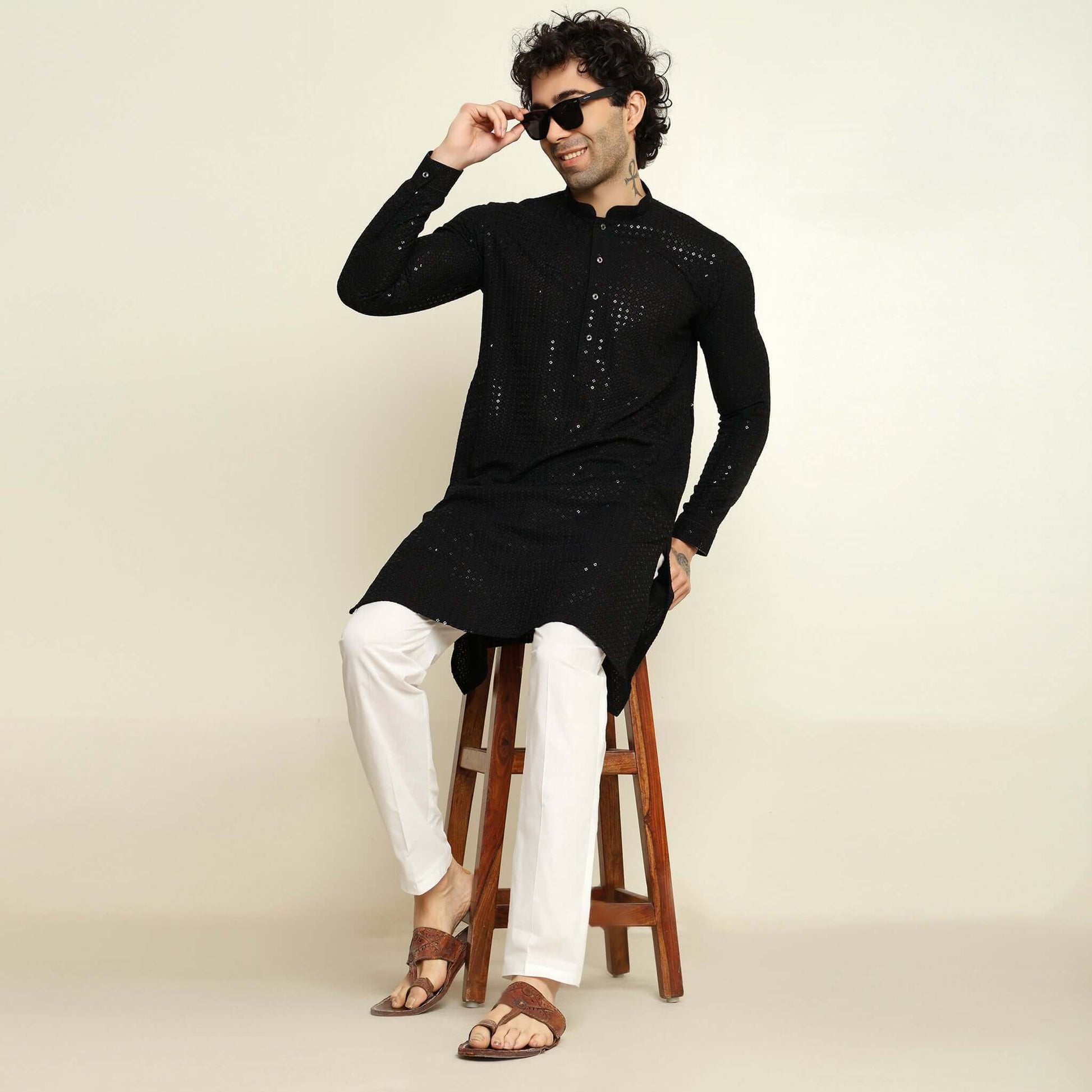 NAQSH Black Sequin Embellished Chikankari Kurta for Men which has chikankari and sequins embellishments. Perfect mens black wedding kurta for male by Crease India.