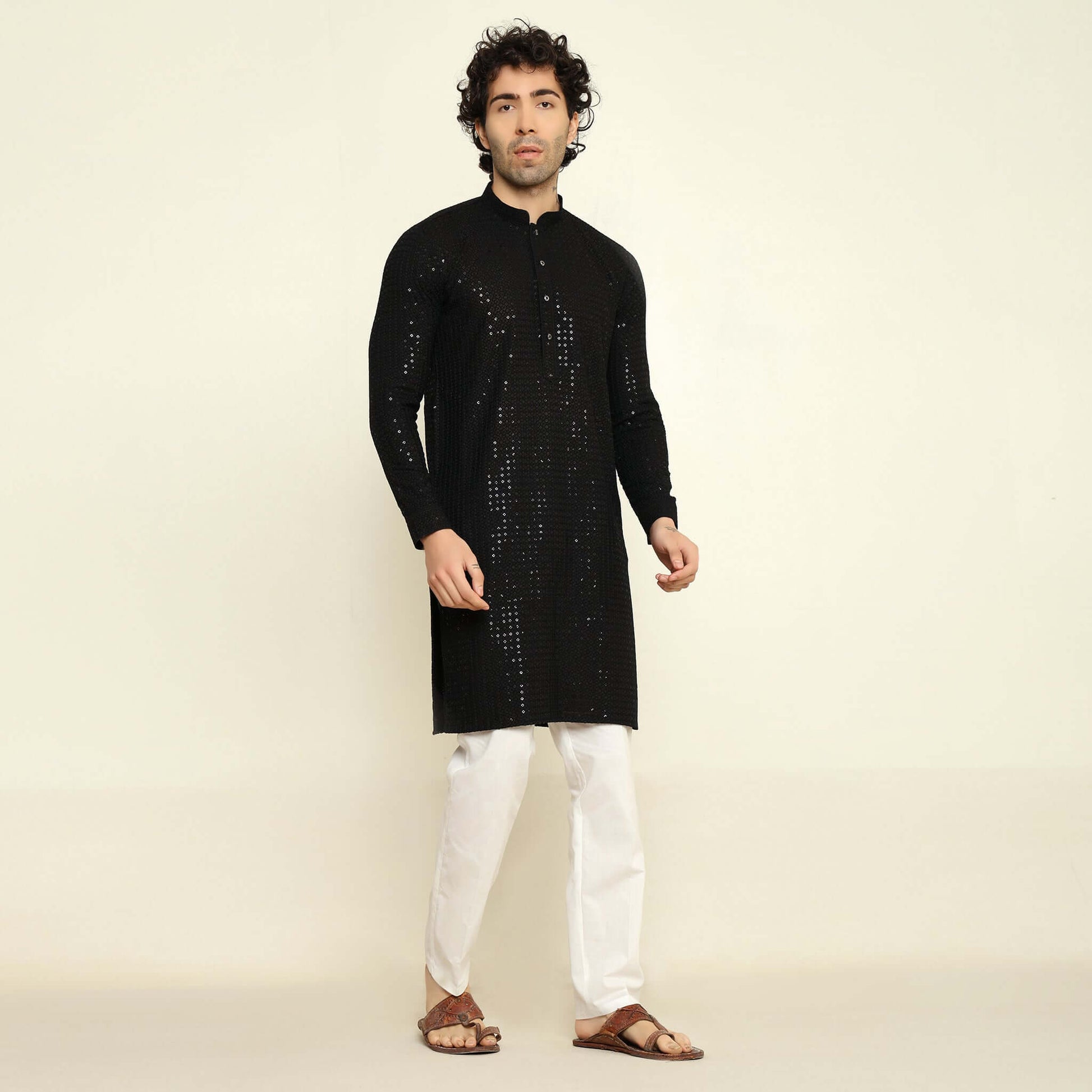 NAQSH Black Sequin Embellished Chikankari Kurta for Men which has chikankari and sequins embellishments. Perfect mens black wedding kurta for male by Crease India.