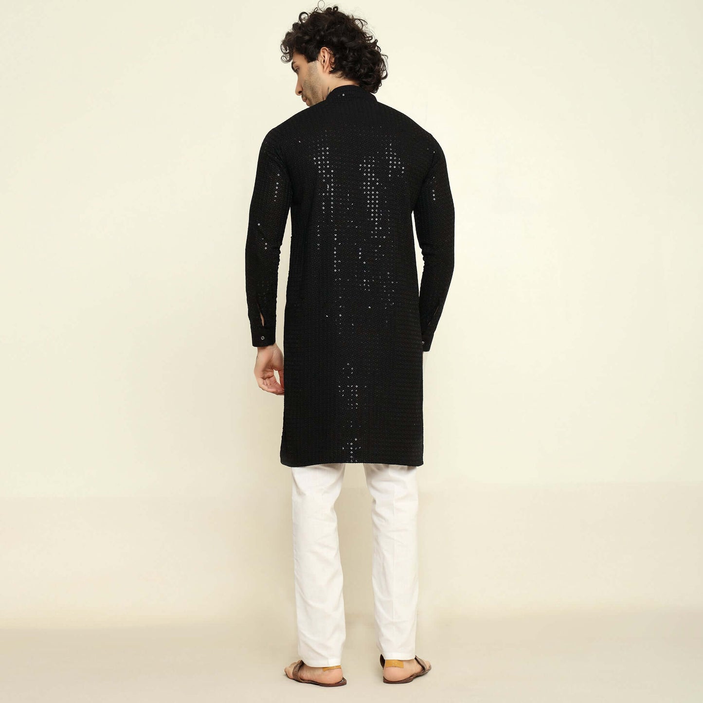 NAQSH Black Sequin Embellished Chikankari Kurta for Men which has chikankari and sequins embellishments. Perfect mens black wedding kurta for male by Crease India.