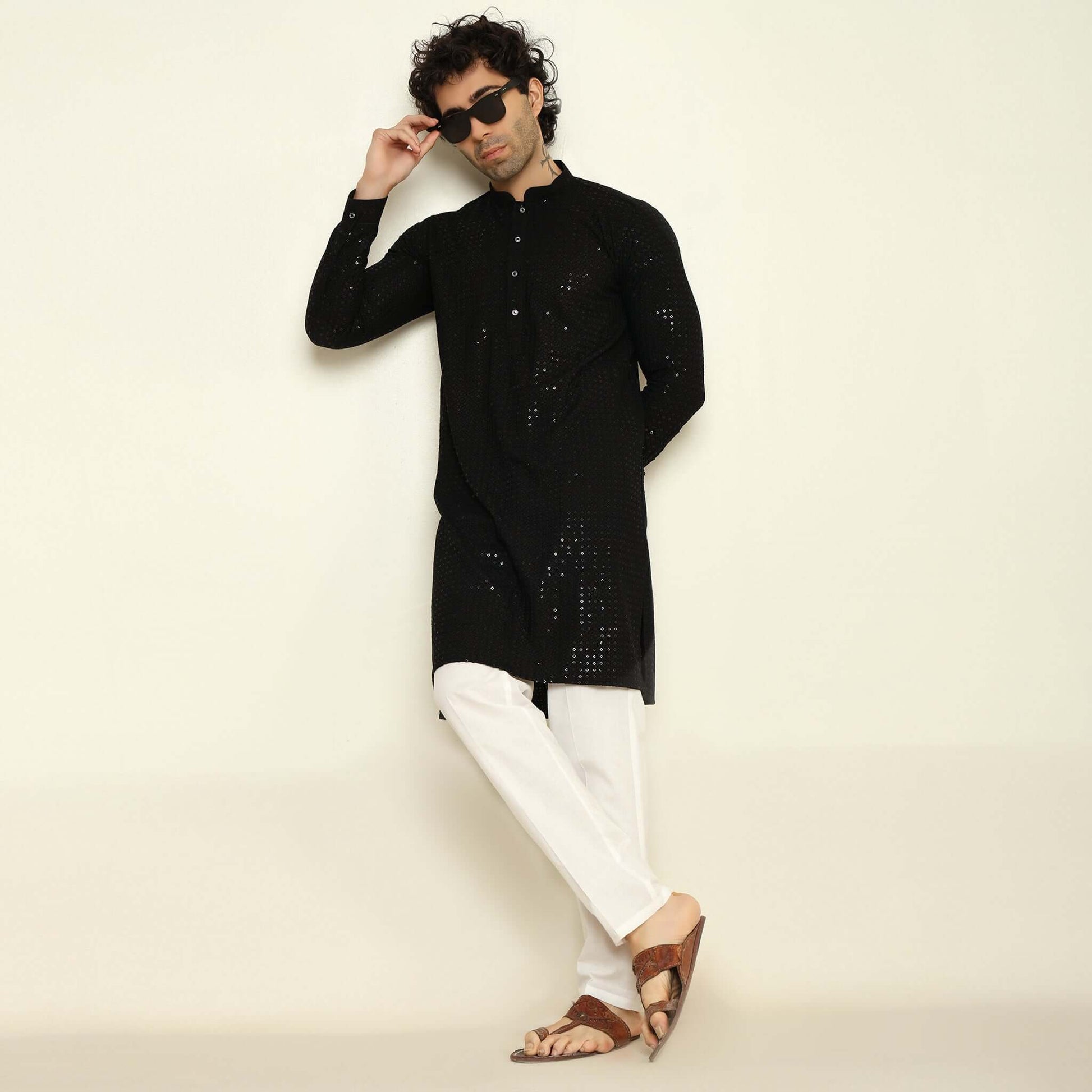 NAQSH Black Sequin Embellished Chikankari Kurta for Men which has chikankari and sequins embellishments. Perfect mens black wedding kurta for male by Crease India.