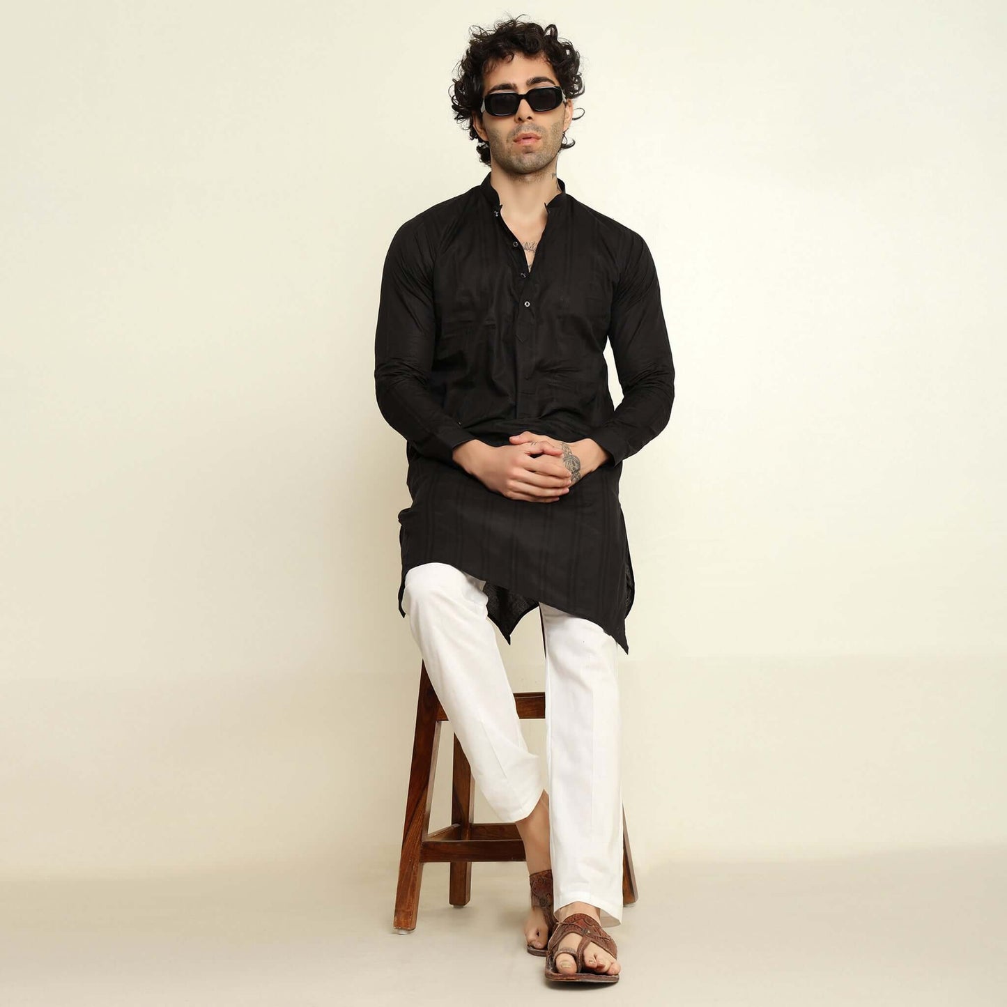 NAQSH Black Jacquard Cotton Kurta Set for Men which has jacquard design. Perfect mens black wedding kurta for male by Crease India.