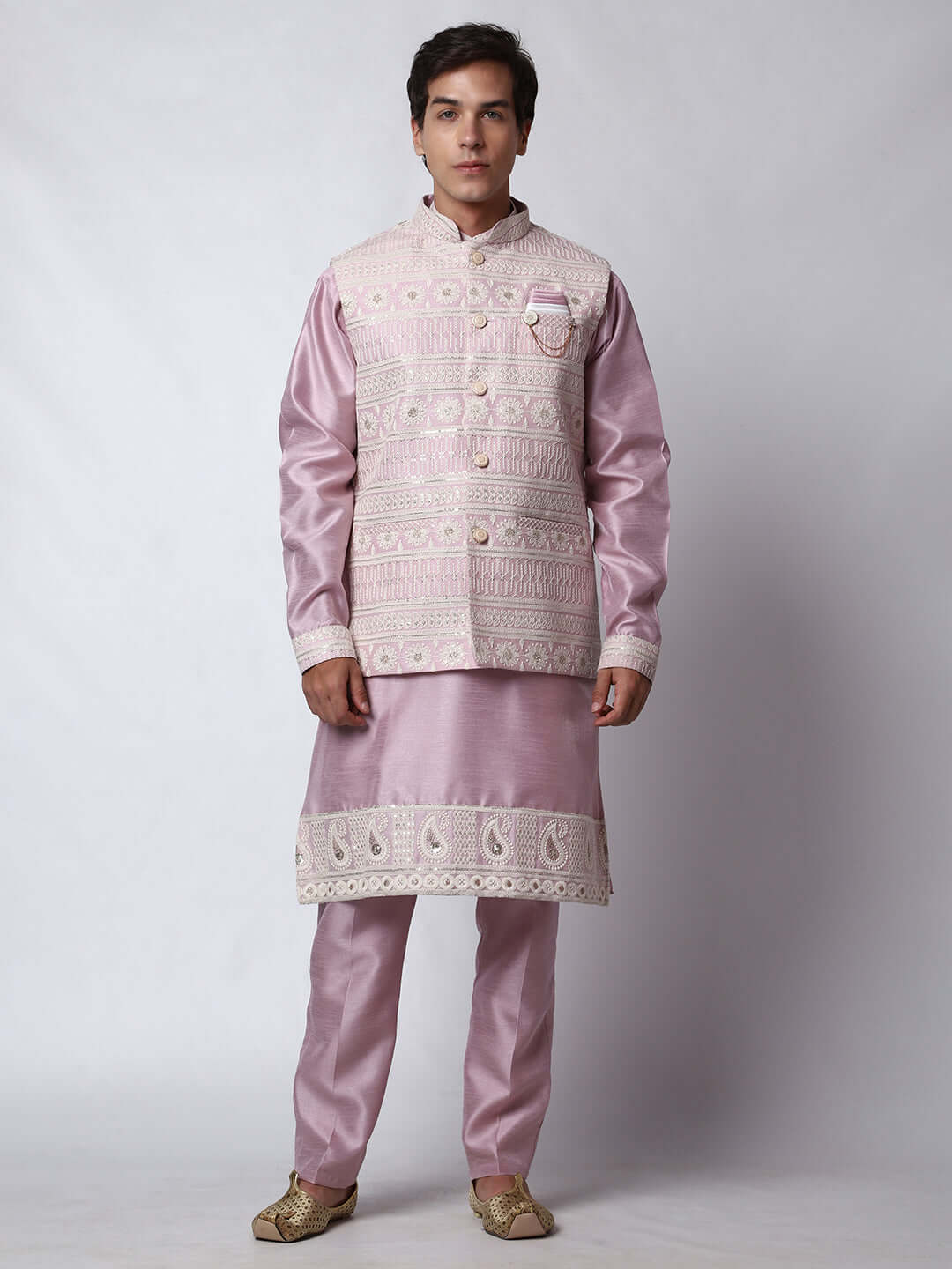 Mauve kurta with mauve nehru jacket for men which is made up of dupion silk and has net embroidery with sequins on it. Shop this mauve designer wedding kurta jacket set for male from Crease India website.