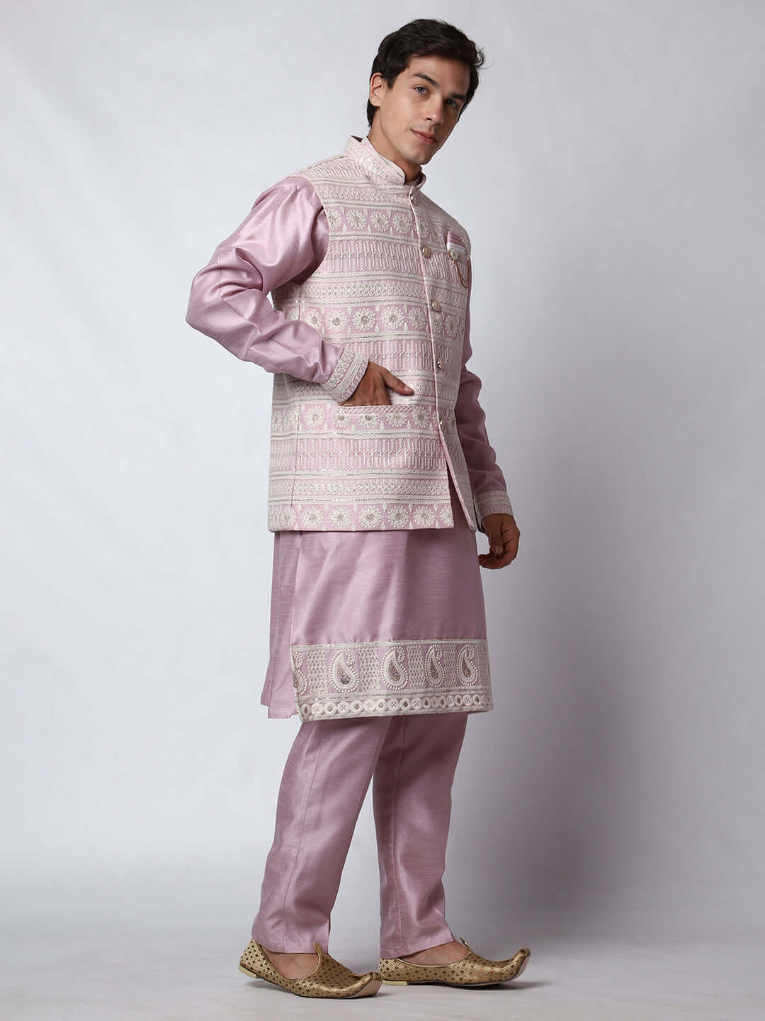 Mauve kurta with mauve nehru jacket for men which is made up of dupion silk and has net embroidery with sequins on it. Shop this mauve designer wedding kurta jacket set for male from Crease India website.