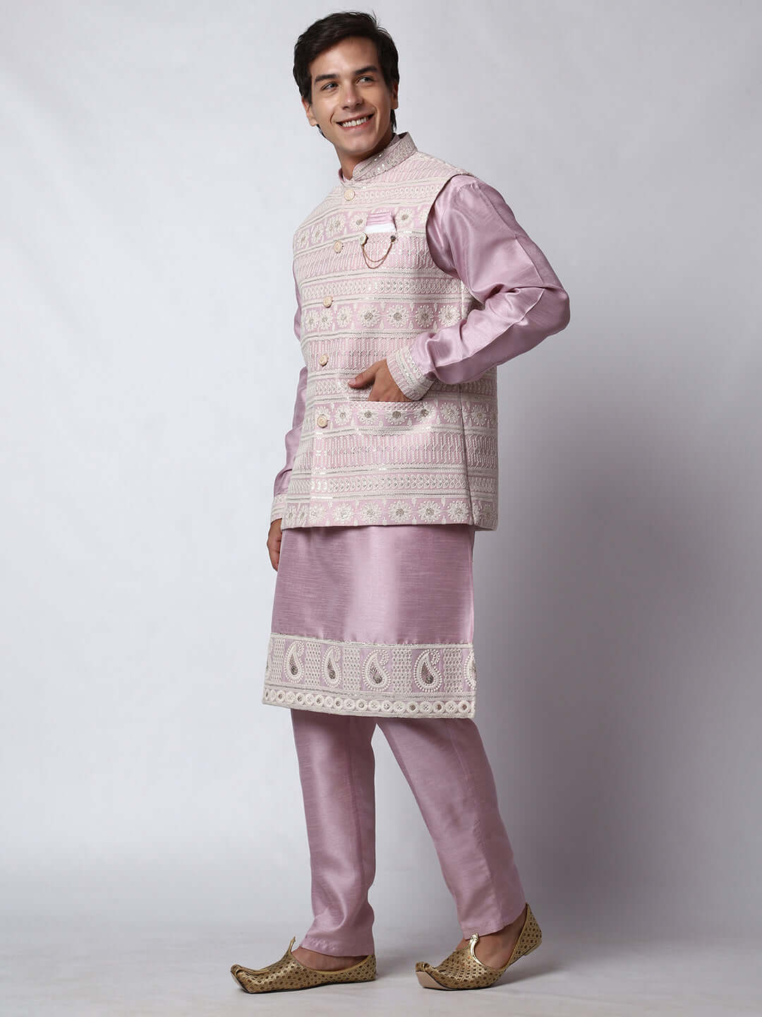 Mauve kurta with mauve nehru jacket for men which is made up of dupion silk and has net embroidery with sequins on it. Shop this mauve designer wedding kurta jacket set for male from Crease India website.