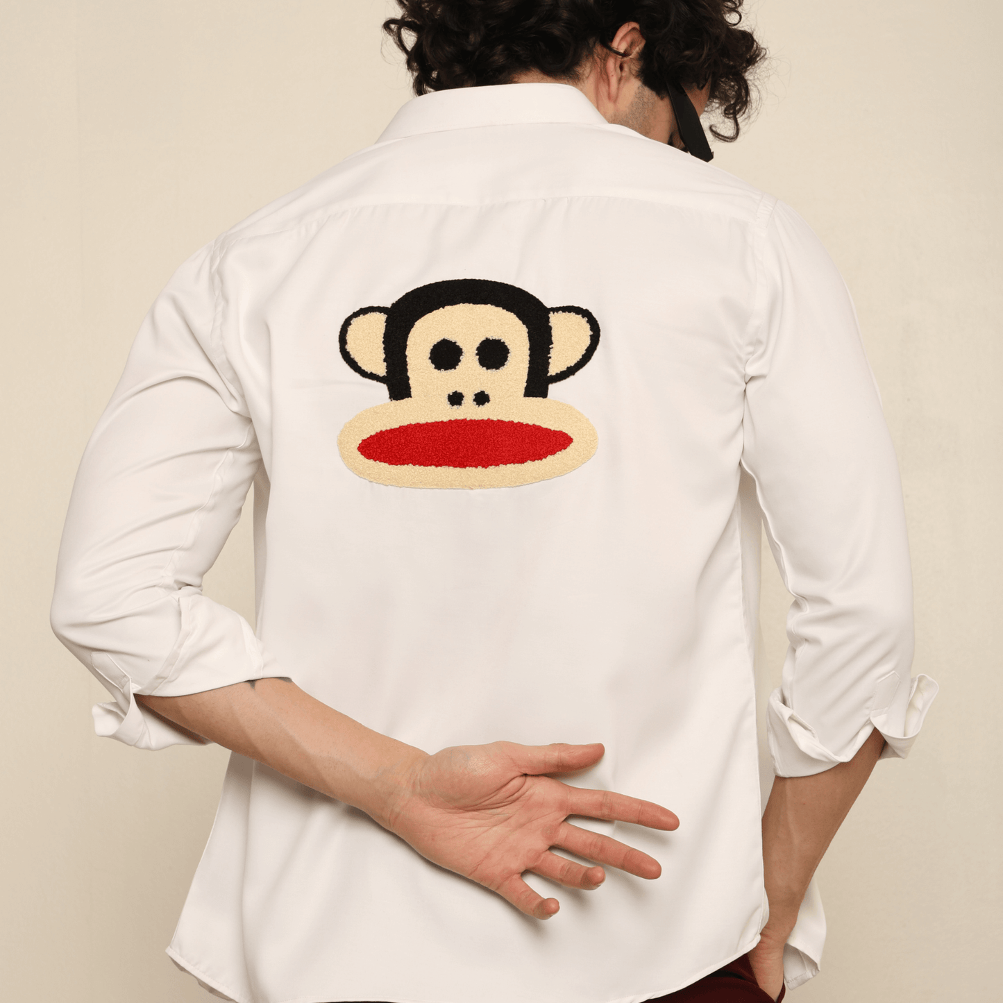 Mischief Alpha Monkey White Giza Satin Shirt for Men which is made up of giza satin and has monkey face design at back.  Perfect designer white custom shirt for all your casual wear.