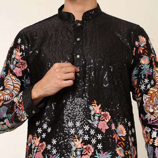 Black Floral Embroidered Kurta for Men which has tiger motif & floral embroidery. Perfect mens black wedding kurta for male by Crease India.