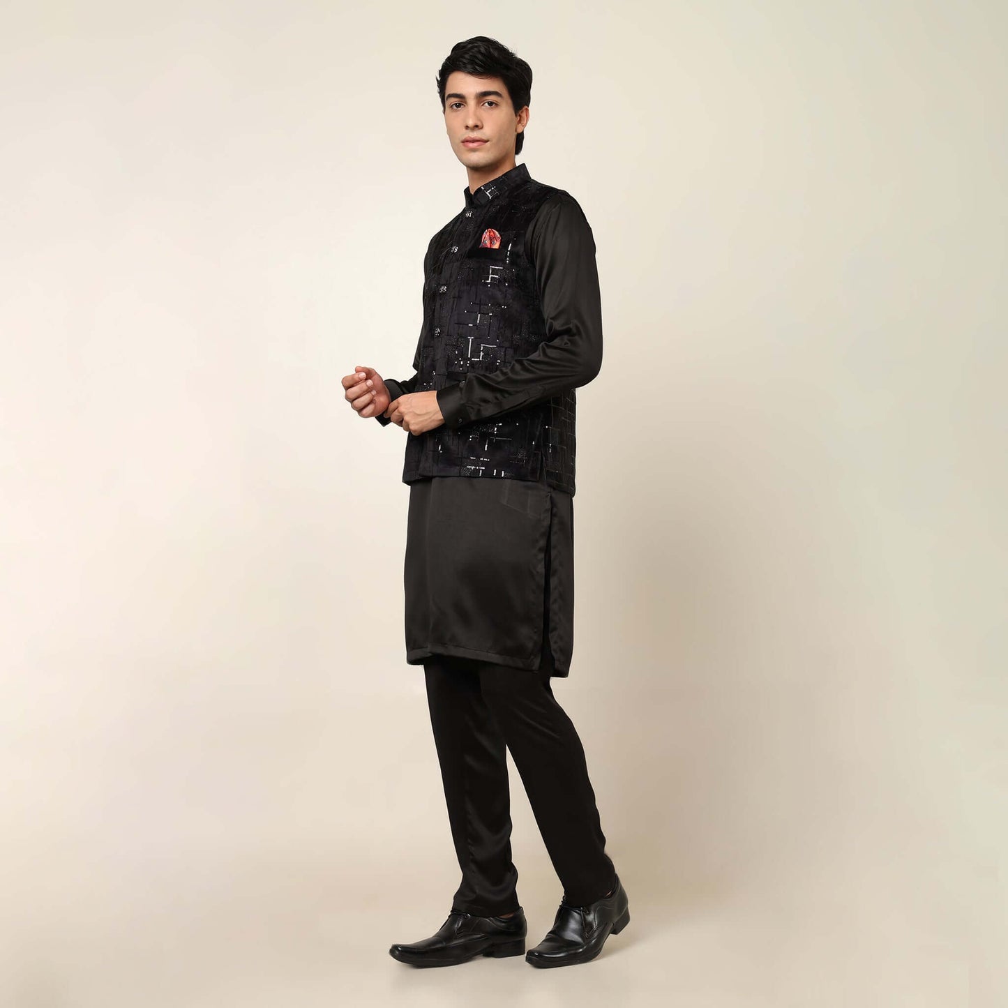 Black kurta with black nehru jacket for men which is made up of suede and has sequence embroidery on it. Shop this black designer wedding kurta jacket set for male from Crease India website.