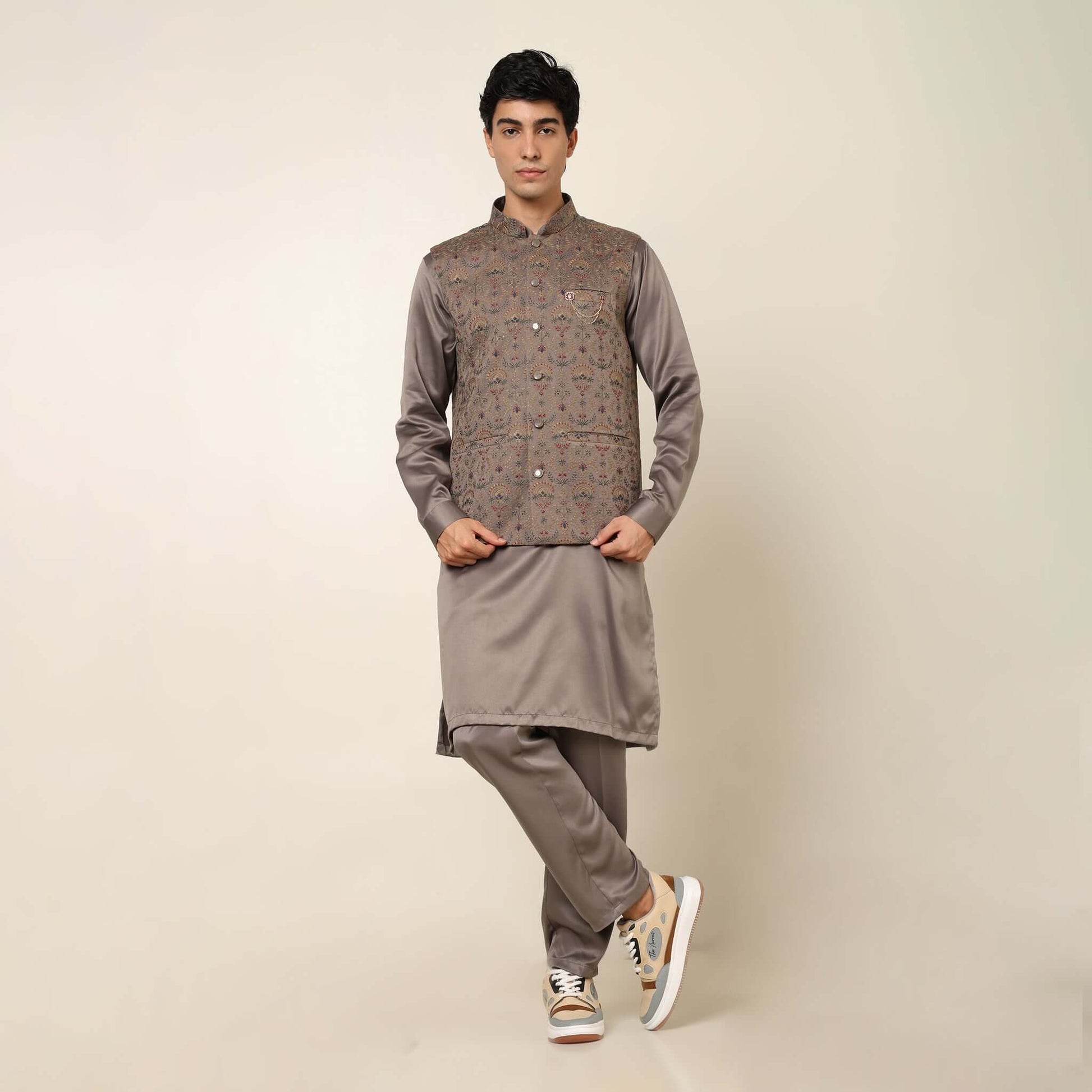 Beige kurta with nehru jacket for men which is made up of satin and has multicolored embroidery on it. Shop this beige designer wedding kurta jacket set for male from Crease India website.