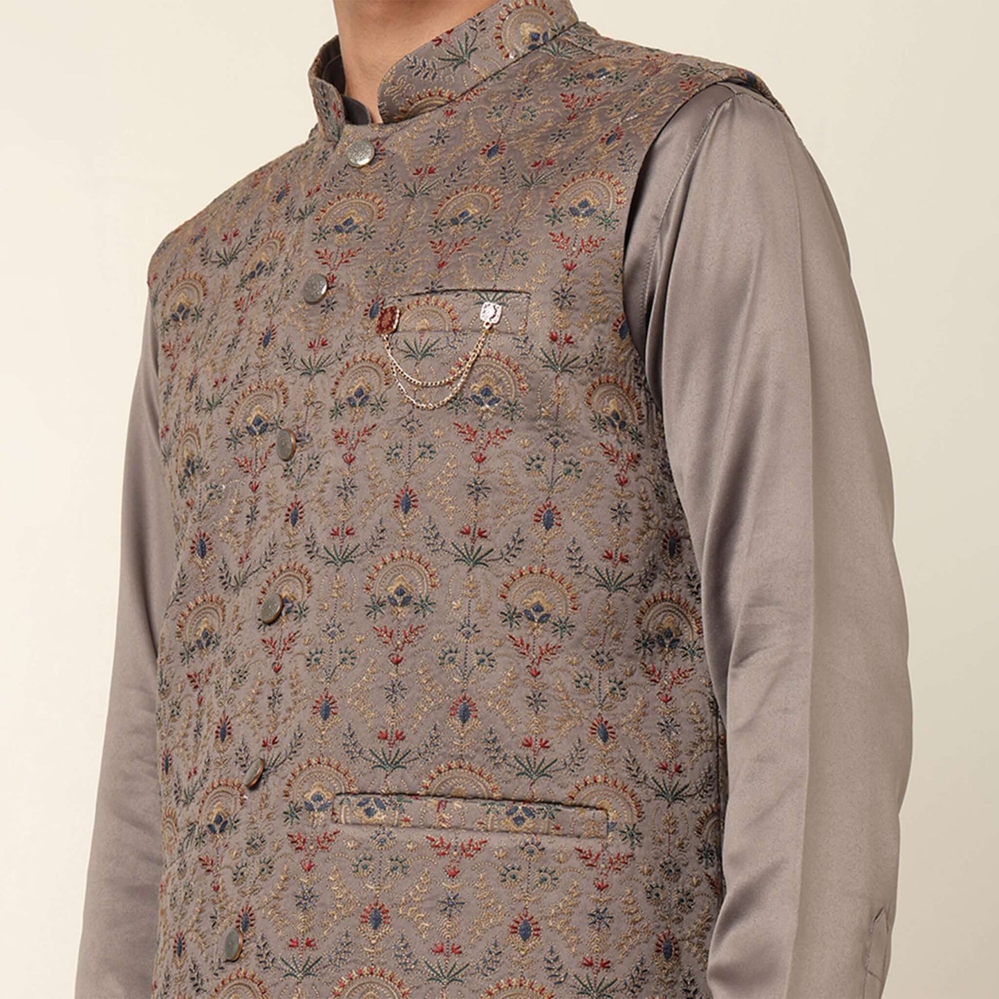 Beige kurta with nehru jacket for men which is made up of satin and has multicolored embroidery on it. Shop this beige designer wedding kurta jacket set for male from Crease India website.