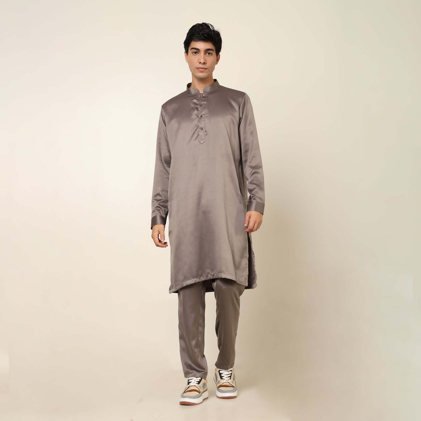 Beige kurta with nehru jacket for men which is made up of satin and has multicolored embroidery on it. Shop this beige designer wedding kurta jacket set for male from Crease India website.