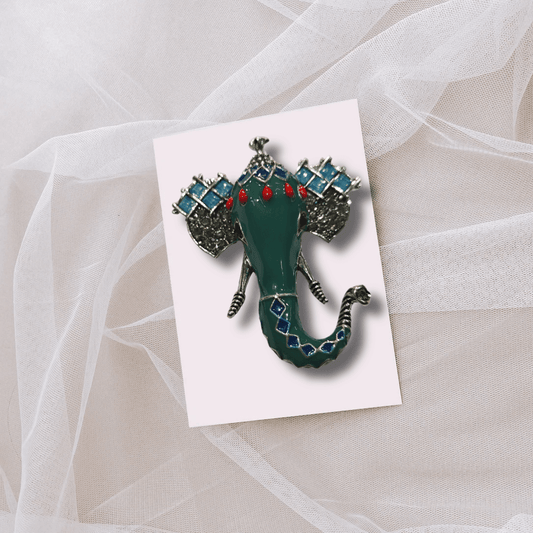 Men's Green Ganesha Brooch Lapel Pin on a light background, designed for tuxedos and traditional Indian wear.