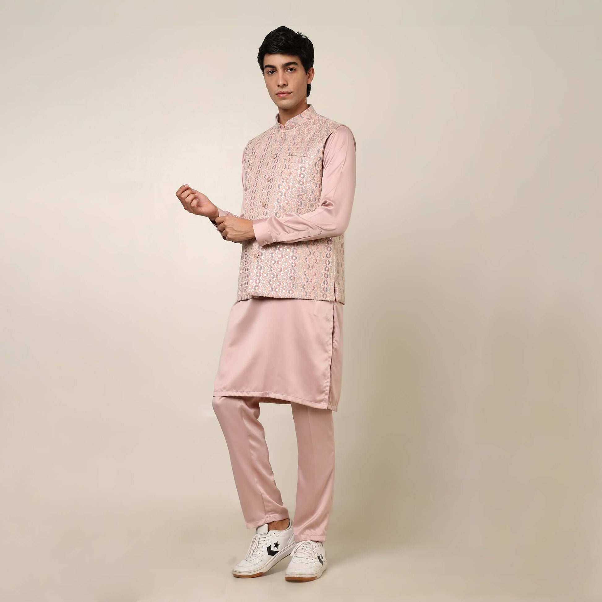 Peach kurta with nehru jacket for men which is made up of satin and has embroidery on it. Shop this peach designer wedding kurta jacket set for male from Crease India website.
