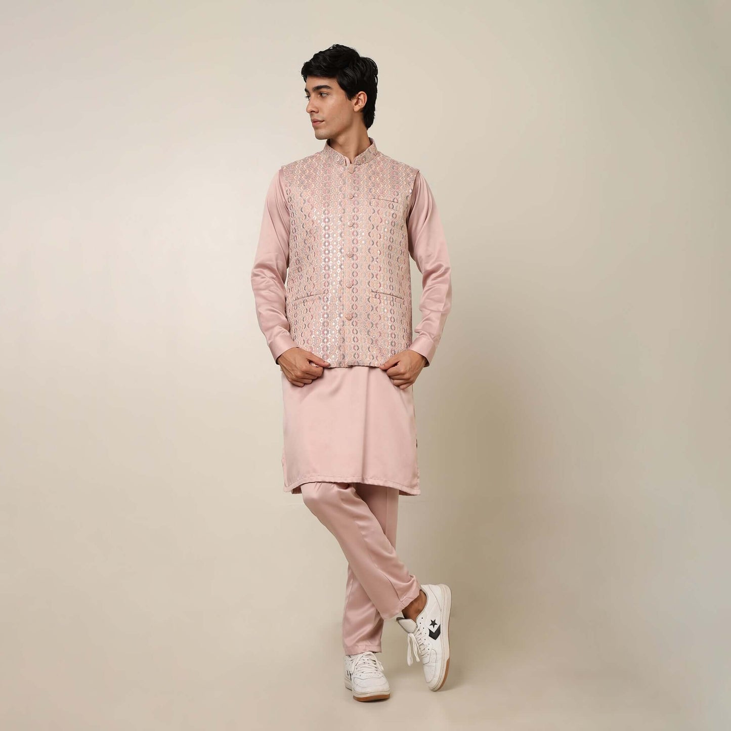 Peach kurta with nehru jacket for men which is made up of satin and has embroidery on it. Shop this peach designer wedding kurta jacket set for male from Crease India website.