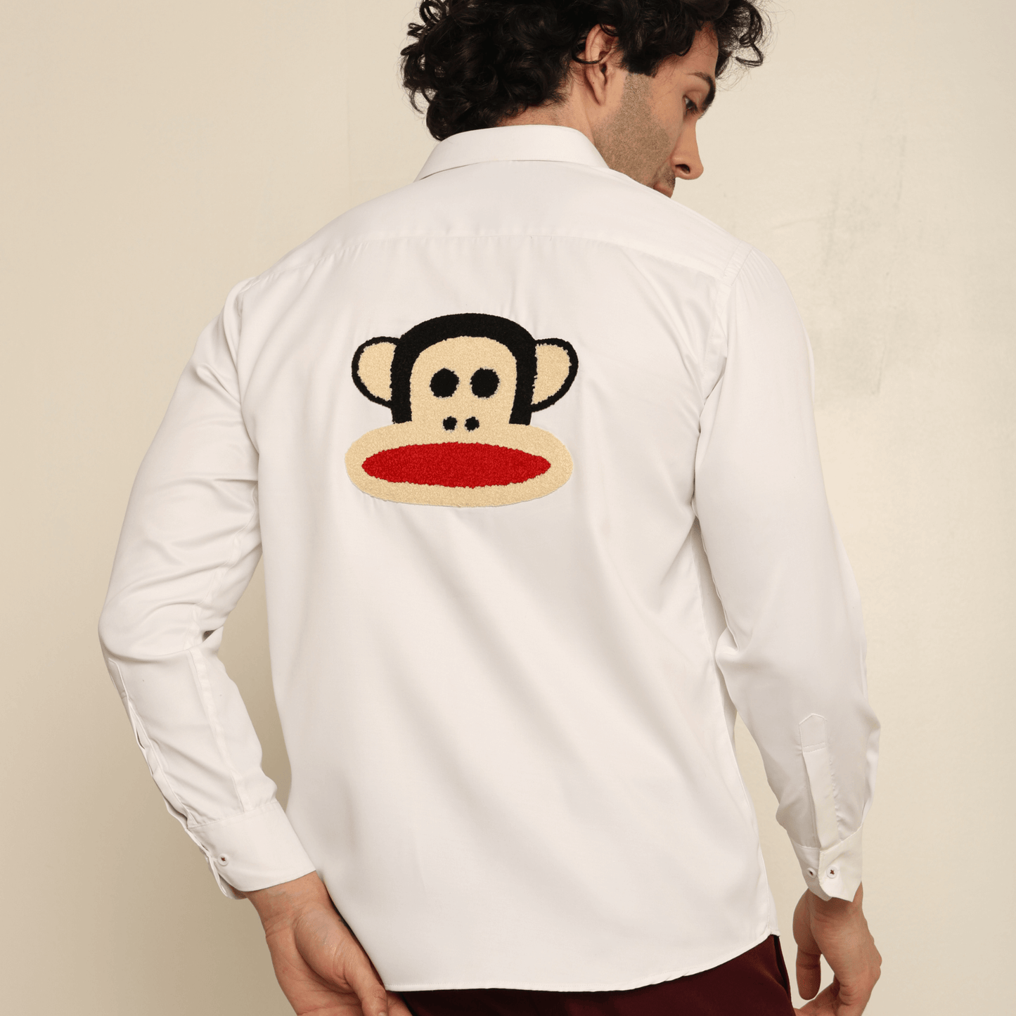Mischief Alpha Monkey White Giza Satin Shirt for Men which is made up of giza satin and has monkey face design at back.  Perfect designer white custom shirt for all your casual wear.
