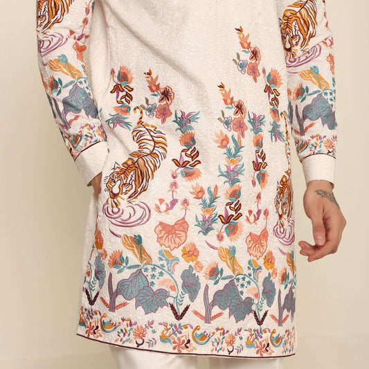 White Floral Embroidered Kurta for Men which has tiger motif & floral embroidery. Perfect mens wedding kurta for male by Crease India.