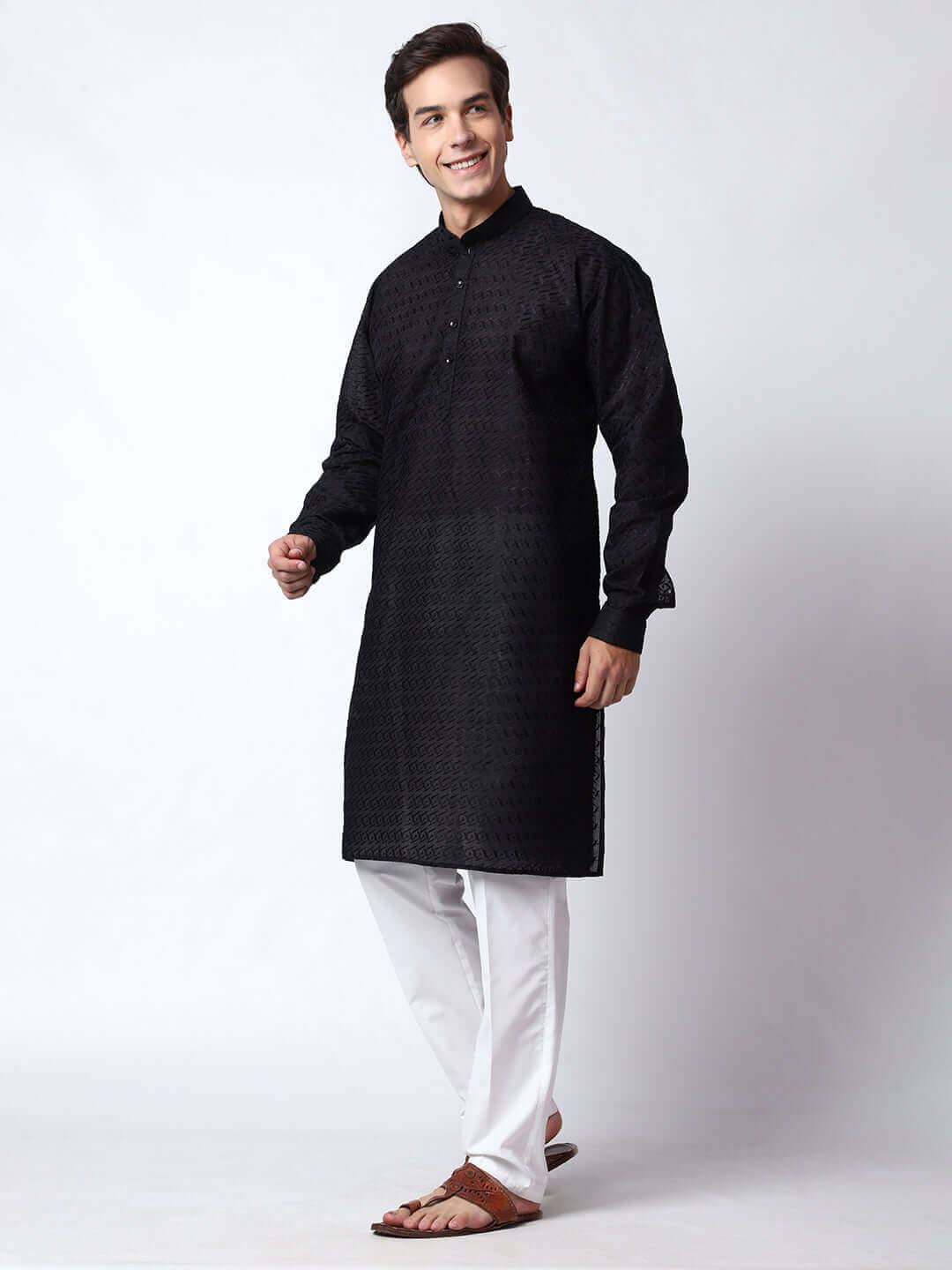 Black Chikankari Kurta for Men, perfect for Indian wedding functions, festivals, casual outings, office ethnic day wear, and other occasions. Shop this chikankari kurta for male on Crease India Website.