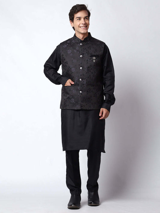 Black kurta with black nehru jacket for men which is made up of dupion silk and has motif designs on it. Shop this black designer wedding kurta jacket set for male from Crease India website.