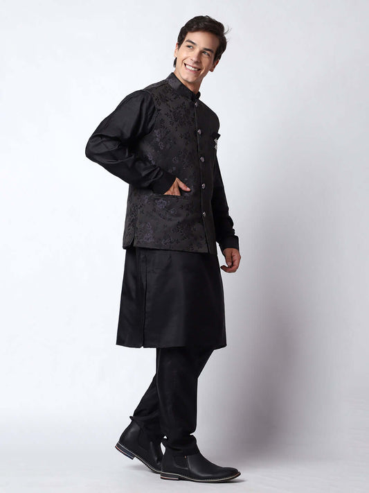Black kurta with black nehru jacket for men which is made up of dupion silk and has motif designs on it. Shop this black designer wedding kurta jacket set for male from Crease India website.