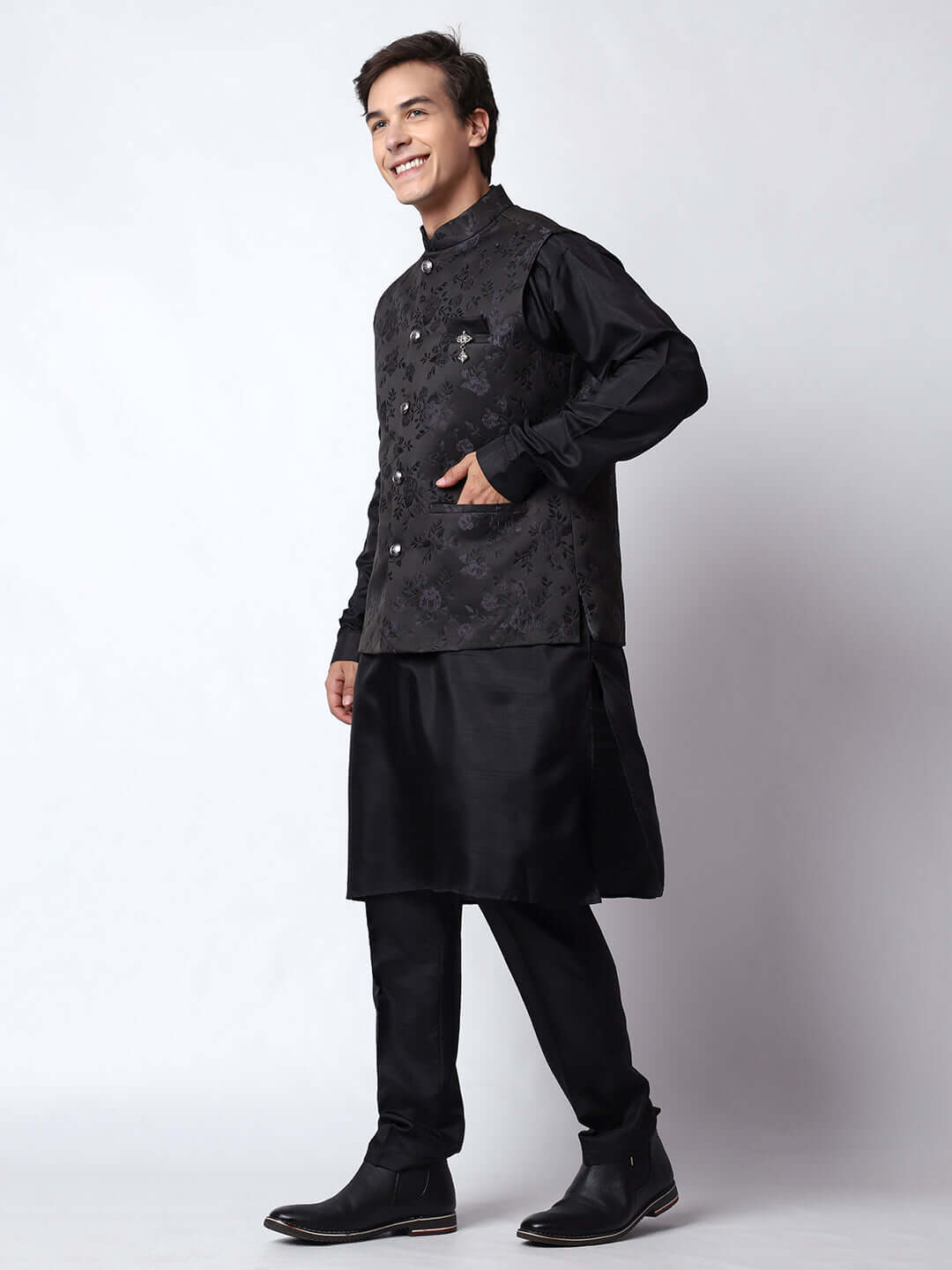 Black kurta with black nehru jacket for men which is made up of dupion silk and has motif designs on it. Shop this black designer wedding kurta jacket set for male from Crease India website.