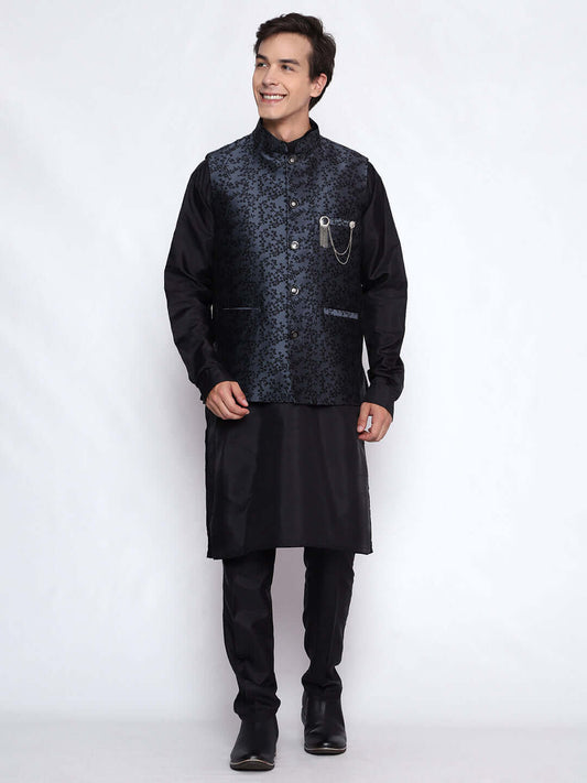 Black kurta with grey nehru jacket for men which is made up of jacquard silk and has floral embroidery on it. Shop this black designer wedding kurta jacket set for male from Crease India website.