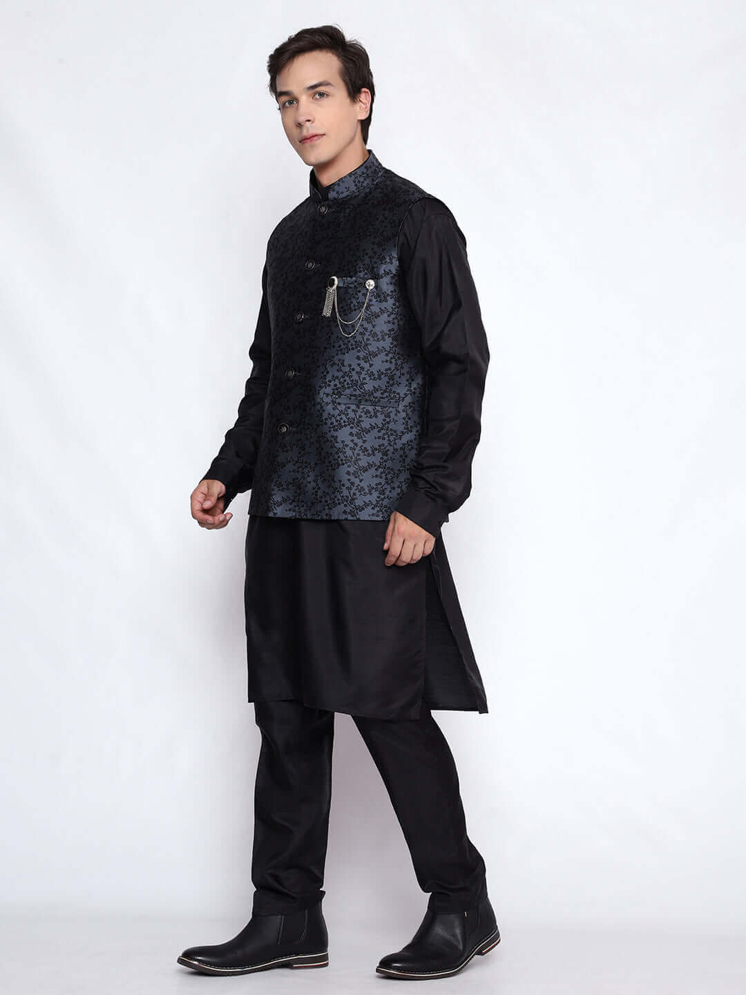 Black kurta with grey nehru jacket for men which is made up of jacquard silk and has floral embroidery on it. Shop this black designer wedding kurta jacket set for male from Crease India website.