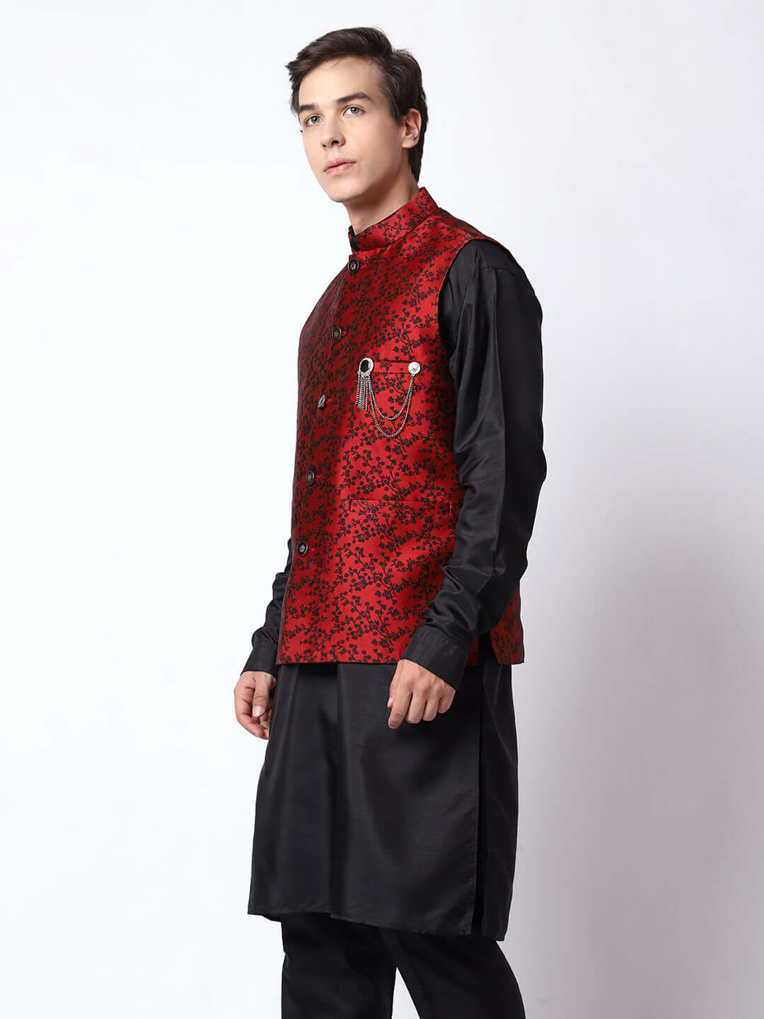 Black kurta with red nehru jacket for men which is made up of jacquard silk and has floral embroidery on it. Shop this black designer wedding kurta jacket set for male from Crease India website.