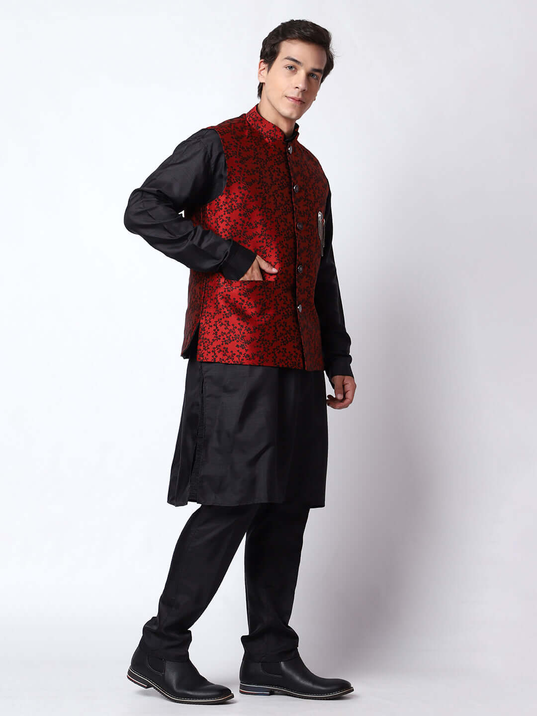 Black kurta with red nehru jacket for men which is made up of jacquard silk and has floral embroidery on it. Shop this black designer wedding kurta jacket set for male from Crease India website.