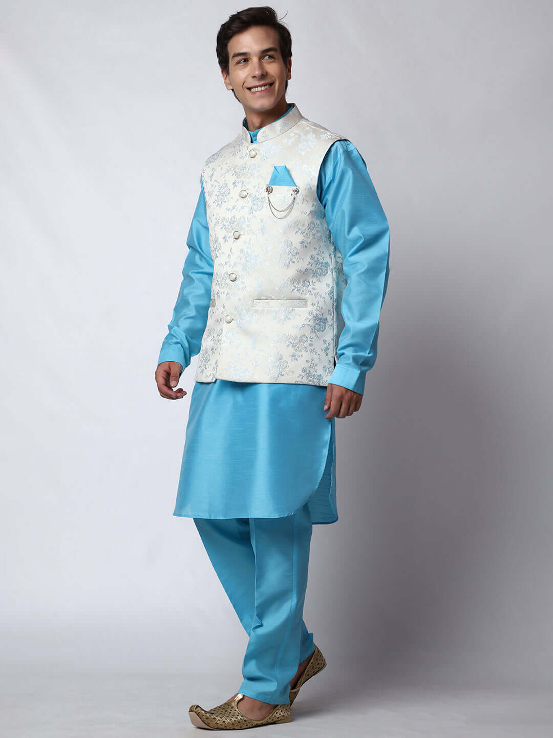Blue kurta with white nehru jacket for men which is made up of jacquard silk and has floral motifs on it.  Shop this designer wedding kurta jacket set for male from Crease India website.