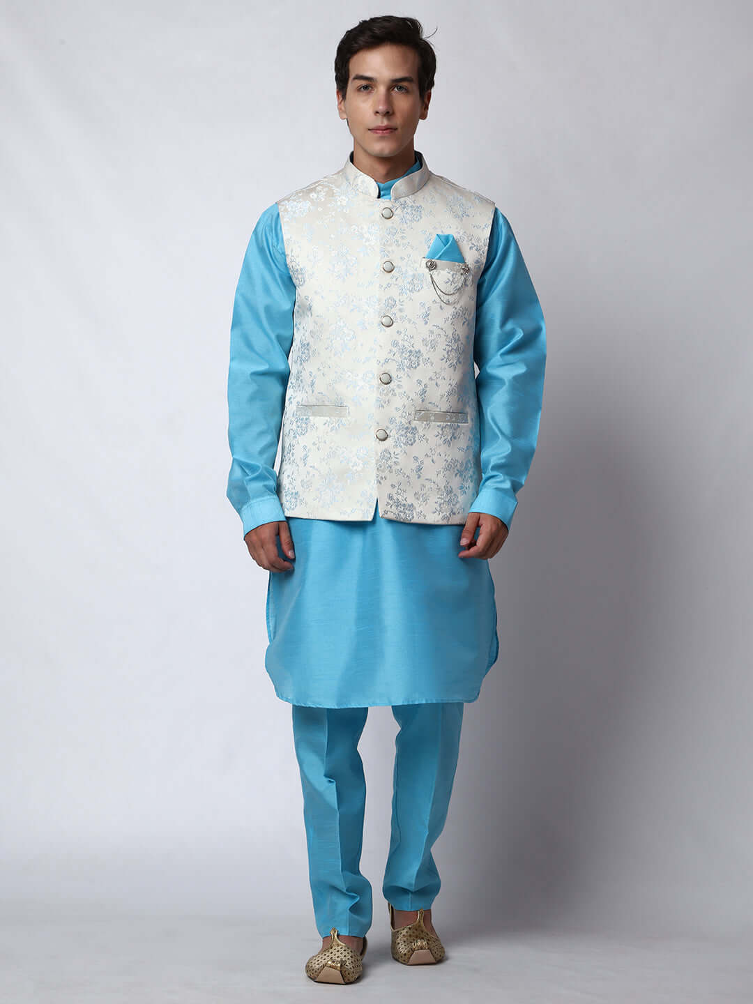 Blue kurta with white nehru jacket for men which is made up of jacquard silk and has floral motifs on it.  Shop this designer wedding kurta jacket set for male from Crease India website.