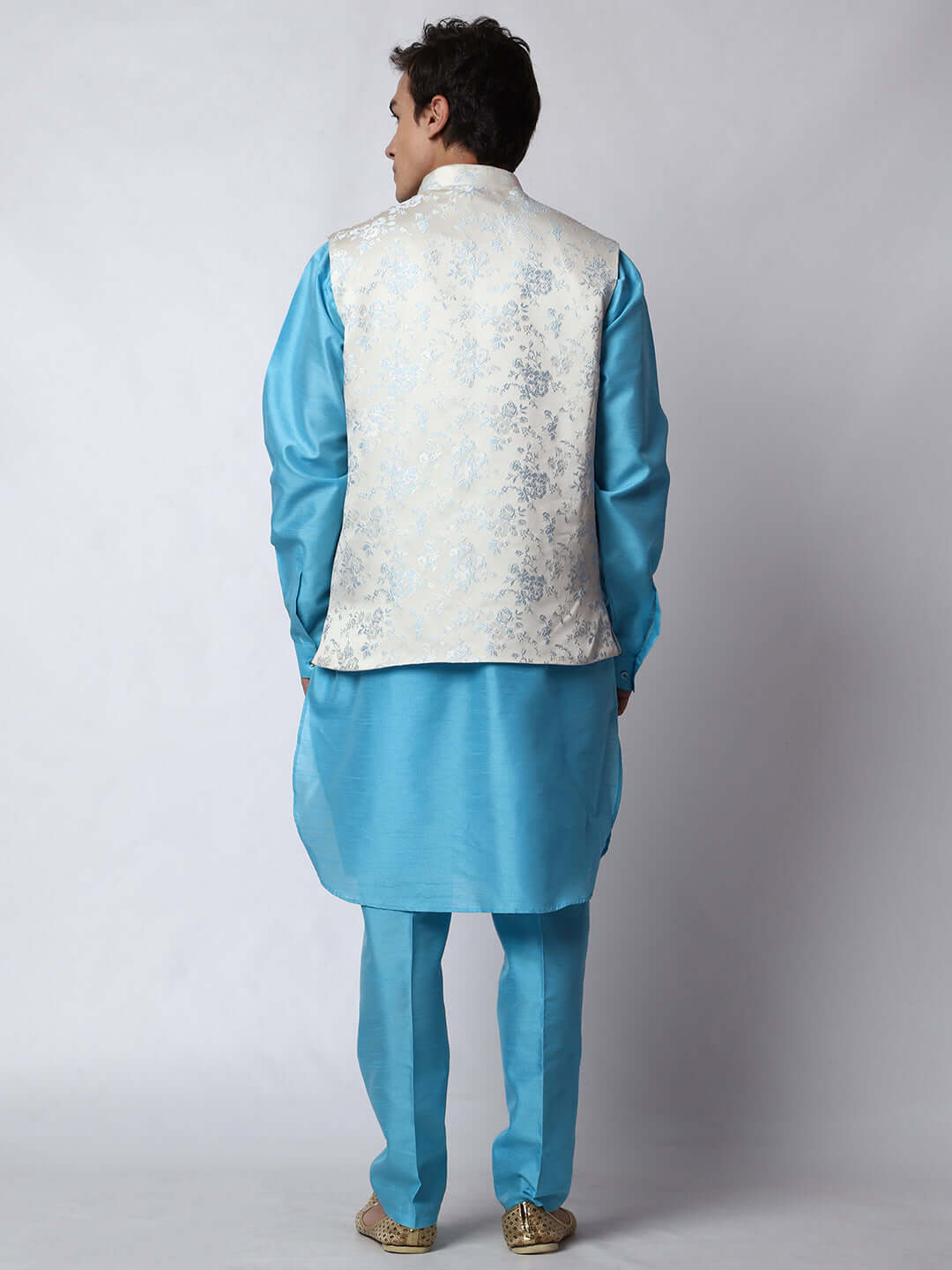 Blue kurta with white nehru jacket for men which is made up of jacquard silk and has floral motifs on it.  Shop this designer wedding kurta jacket set for male from Crease India website.