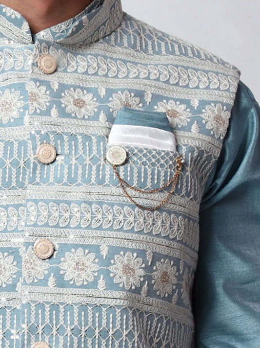 Turquoise Blue kurta with blue nehru jacket for men which is made up of dupion silk and has net embroidery with sequins on it. Shop this turquoise blue designer wedding kurta jacket set for male from Crease India website.