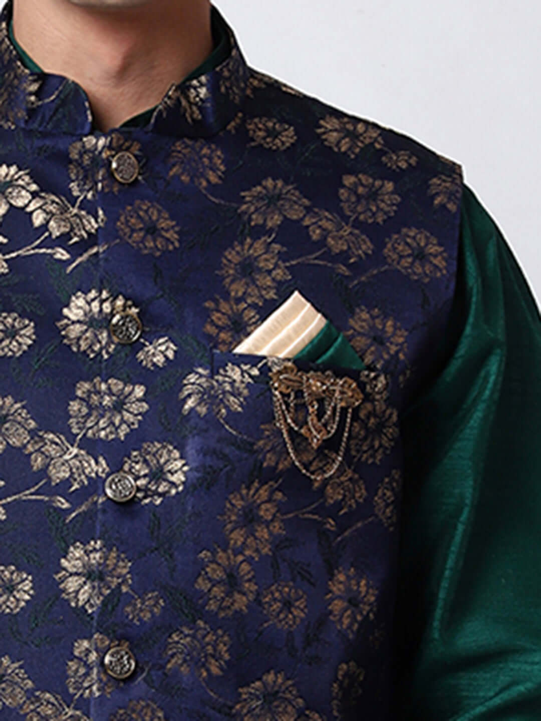 Dark Green kurta with midnight blue nehru jacket for men which is made up of dupion silk and has golden floral embroidery on it. Shop this dark green designer wedding kurta jacket set for male from Crease India website.