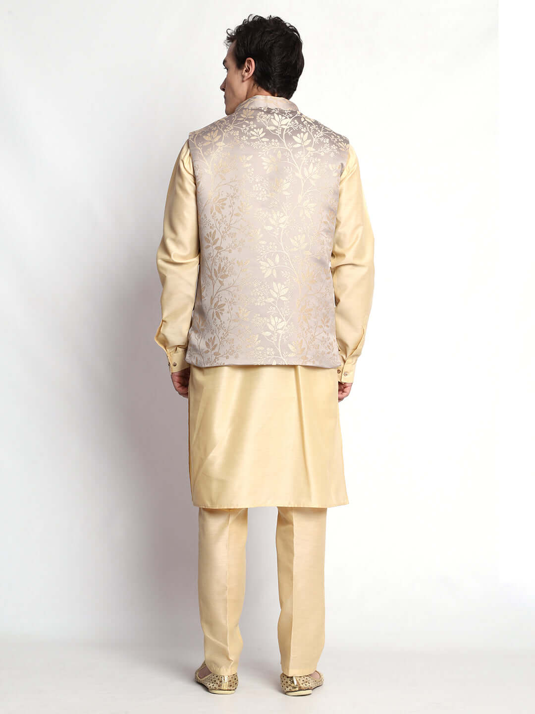 Fawn kurta with grey nehru jacket for men which is made up of satin and has floral embroidery on it. Shop this fawn designer wedding kurta jacket set for male from Crease India website.