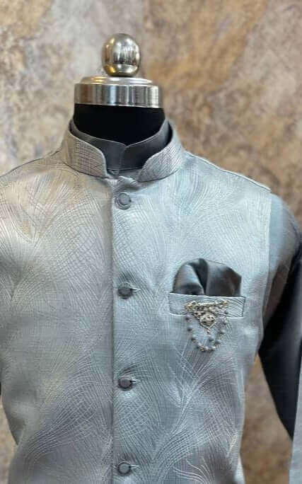 Grey kurta with nehru jacket for men which is made up of imported italian jacquard and has abstract designs on it. Shop this grey designer wedding kurta jacket set for male from Crease India website.