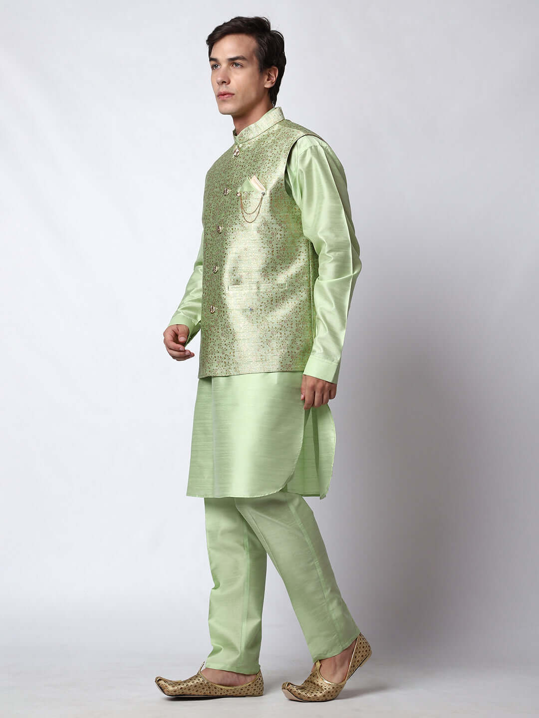 Lush Green kurta with nehru jacket for men which is made up of dupion silk and has golden petal embroidery on it. Shop this lush green designer wedding kurta jacket set for male from Crease India website.