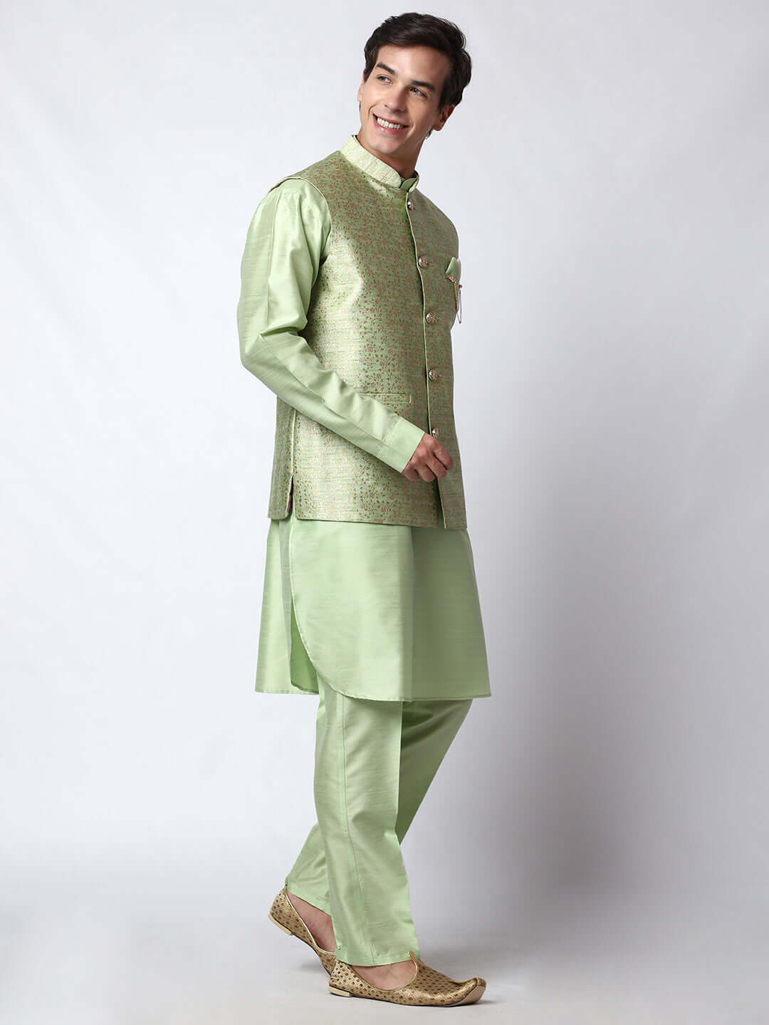 Lush Green kurta with nehru jacket for men which is made up of dupion silk and has golden petal embroidery on it. Shop this lush green designer wedding kurta jacket set for male from Crease India website.