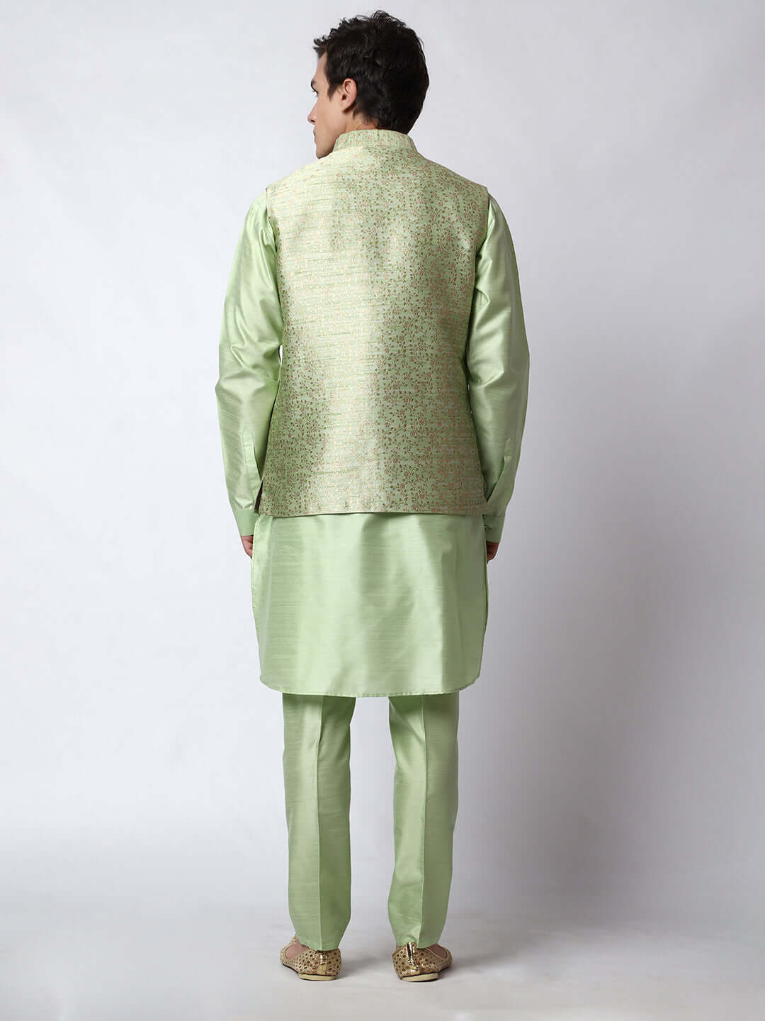 Lush Green kurta with nehru jacket for men which is made up of dupion silk and has golden petal embroidery on it. Shop this lush green designer wedding kurta jacket set for male from Crease India website.