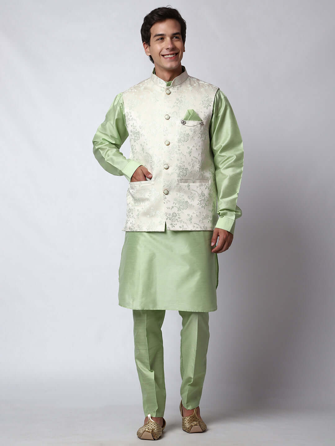 Pista Green kurta with white nehru jacket for men which is made up of jacquard and has floral embroidery on it. Shop this pista green designer wedding kurta jacket set for male from Crease India website.