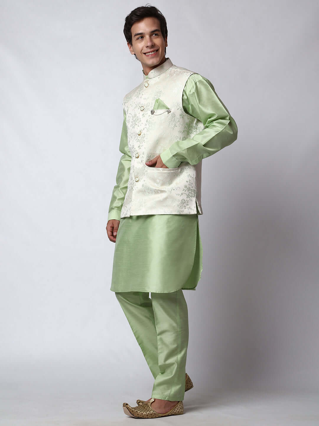 Pista Green kurta with white nehru jacket for men which is made up of jacquard and has floral embroidery on it. Shop this pista green designer wedding kurta jacket set for male from Crease India website.